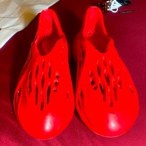 BRAND NEW RED HOLLOW OUT SLIP ONS.